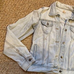 Light distressed denim jacket